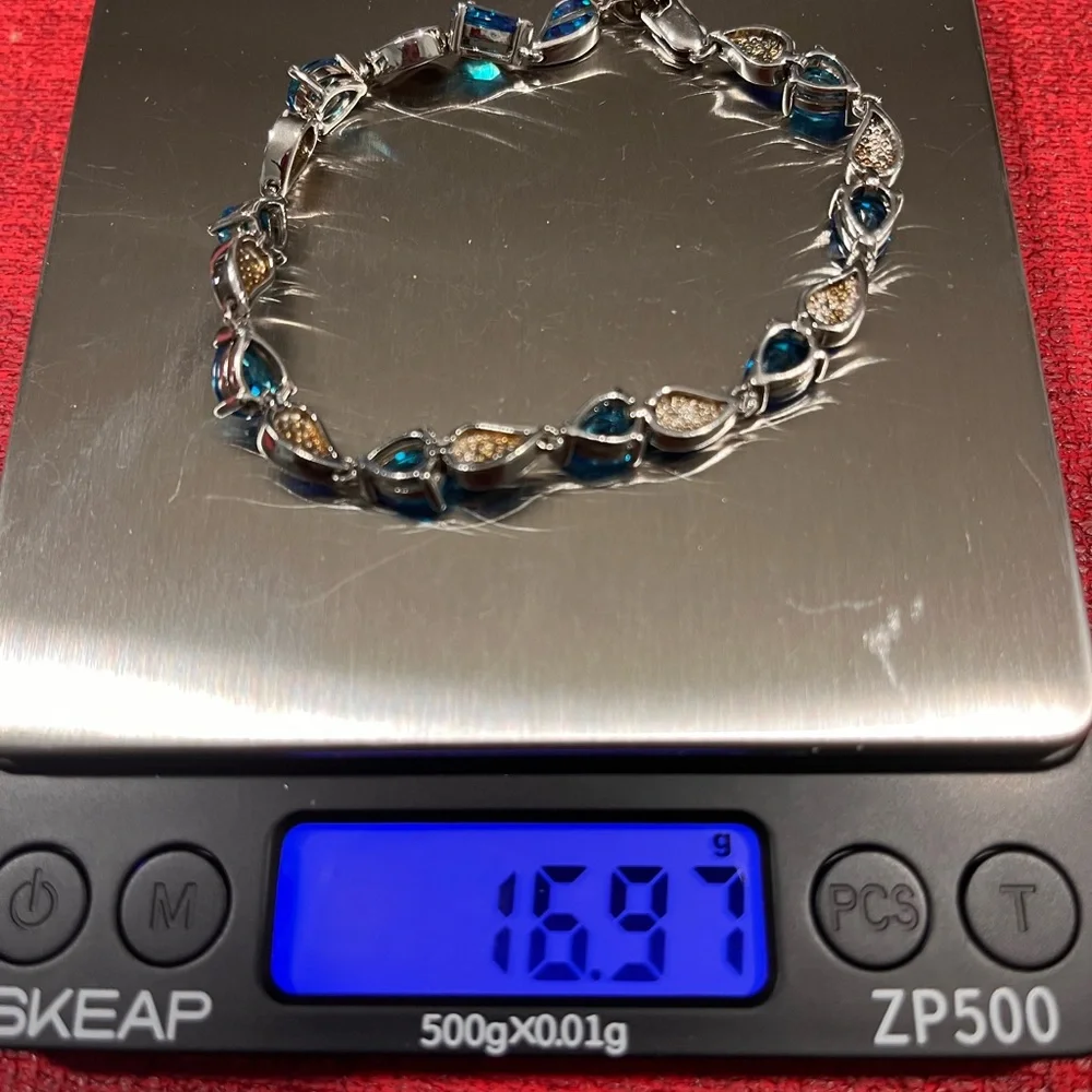 LOVED AUTHENTIC LONDON BLUE TOPAZ STONES/BLUE FIRE OPAL STERLING SILVER BRACELET